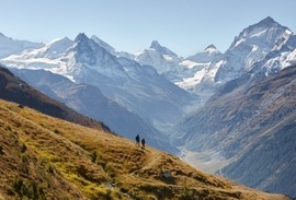 Hiker on Swiss trails in the Alps