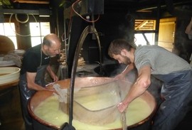 Cheese making in a cauldron