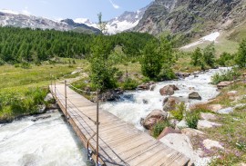 Water crossing on a summer day hiking in Saas-Fee